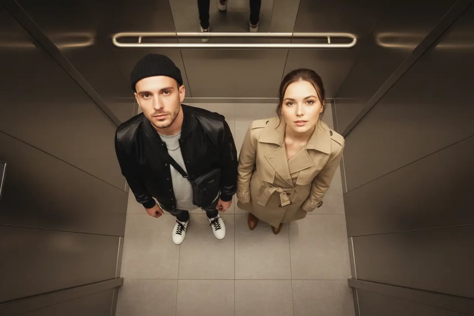 Modern Elevator Selfie with Upward Gaze